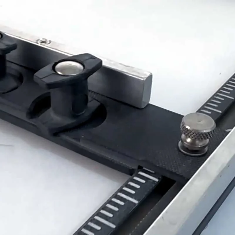 Adjustable universal composite pallet fixture layout showing sliding edge rails and guide bars