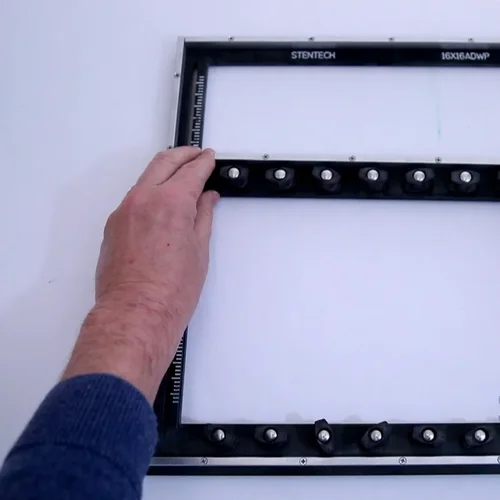 Universal wave solder pallet showing center adjustment rails and locking clips