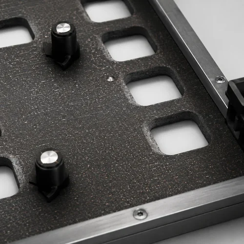 Selective wave solder fixture showing precision knife-edge beveling for component openings