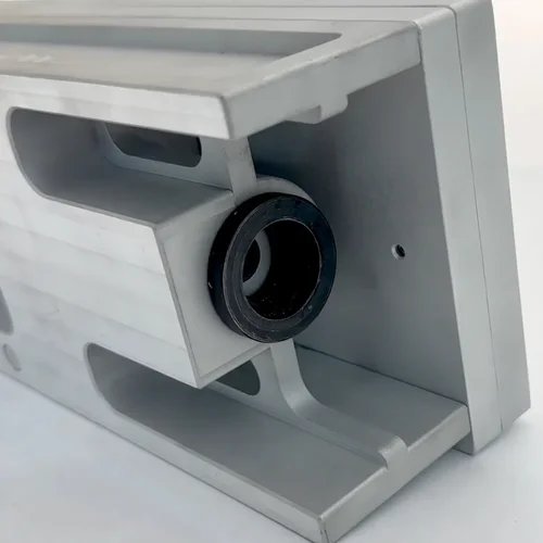 Machined details of press fit support plate showing precision guide pin holes